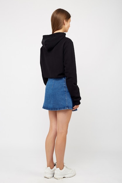 Girl in a denim skirt and a black jacket