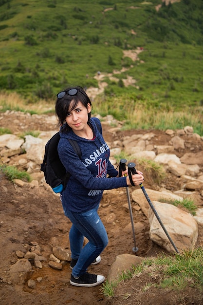 Girl Descend Down a Large Green Mountain Range