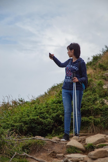 Girl Descend Down a Large Green Mountain Range