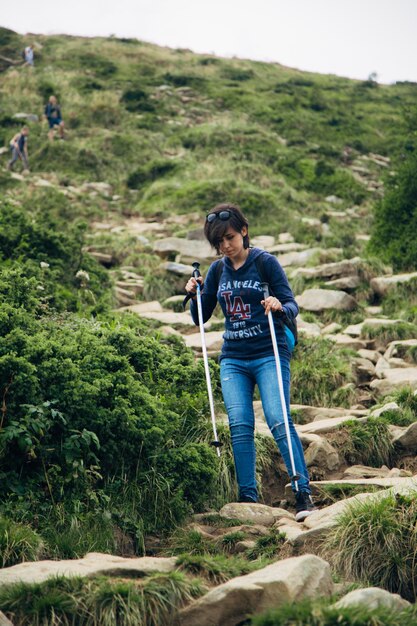 Girl Descend Down a Large Green Mountain Range