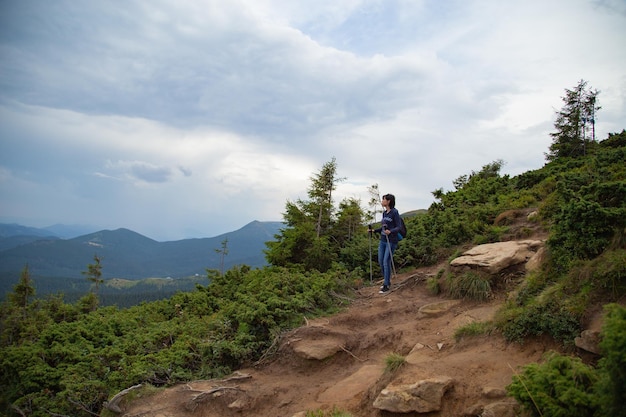 Girl Descend Down a Large Green Mountain Range