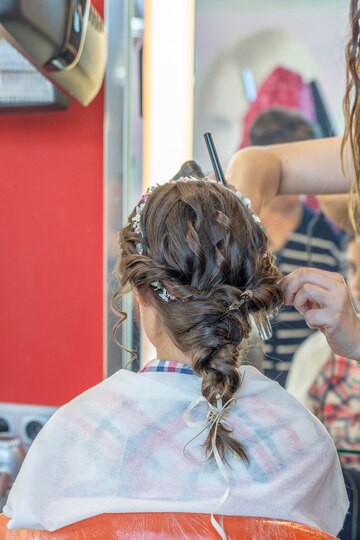 Premium Photo | Girl doing hairstyle before communion by professional stylistxa Premium Photo | Girl doing hairstyle before communion by professional stylistxa