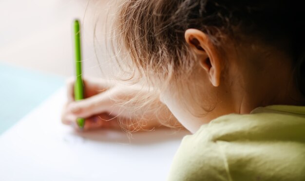 A girl doing her homework at home.