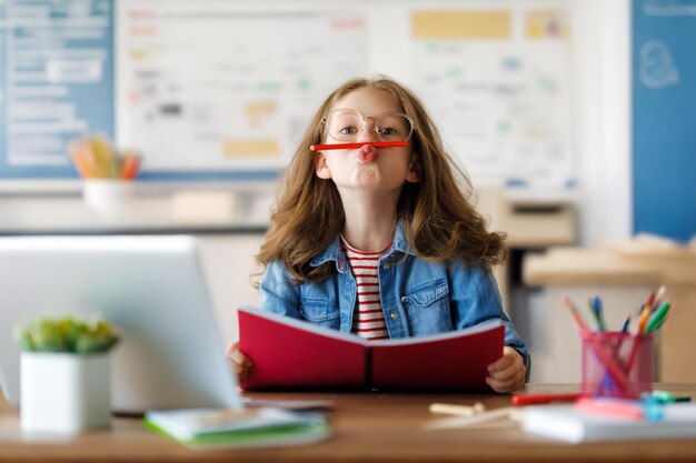 Girl doing homework or online education