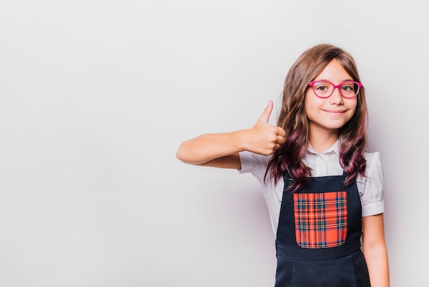 Girl doing thumbs up gesture