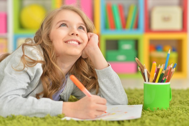 Girl drawing at home