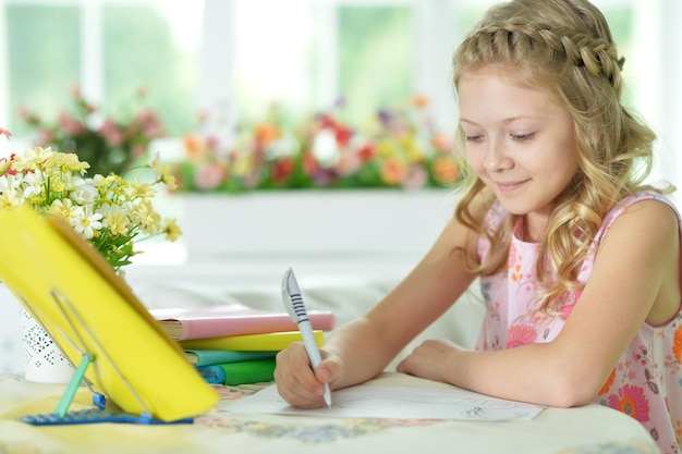 Girl drawing at home