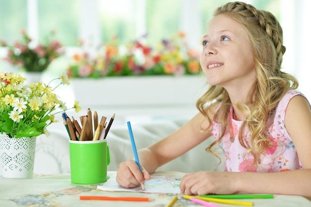 Girl drawing at home