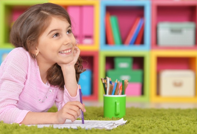 Girl drawing at home