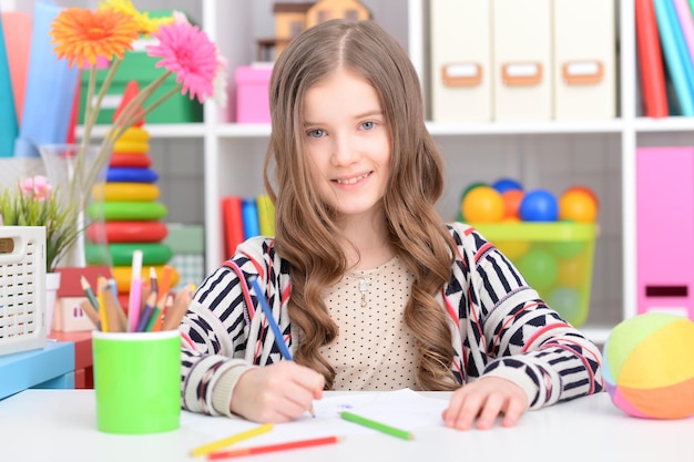 Girl drawing at home