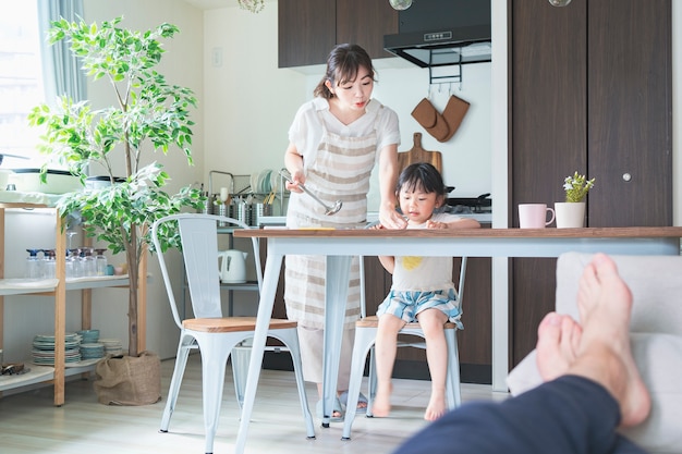 A girl drawing in the kitchen