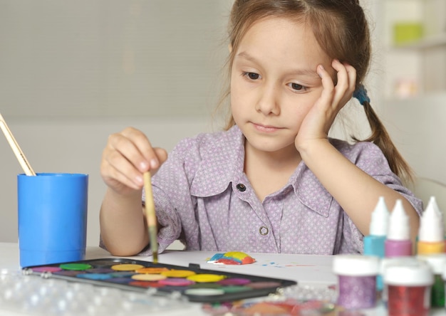 Girl drawing with brush