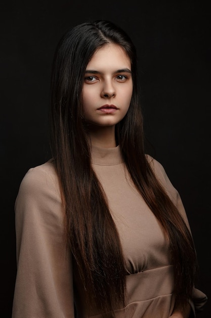 a girl in a dress on a brown background