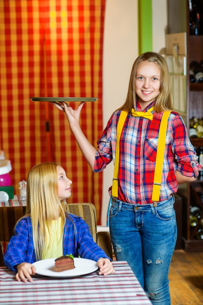 Girl dressed as waitress and visitor