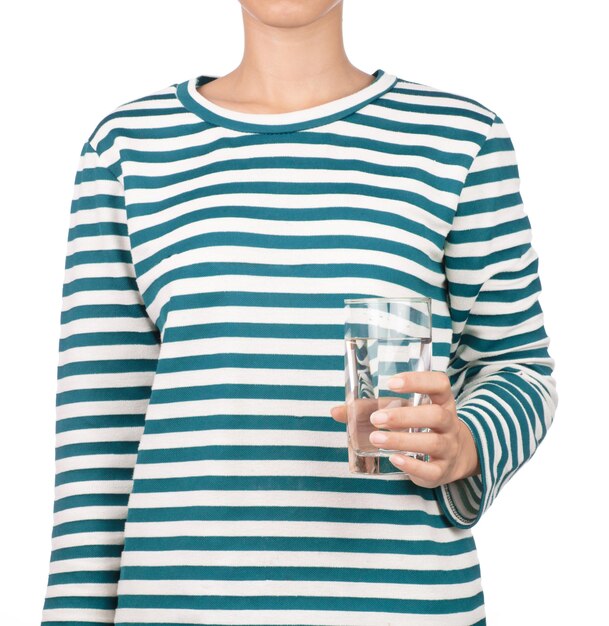 girl dressed in long sleeve shirt hold glass of water isolated on white background