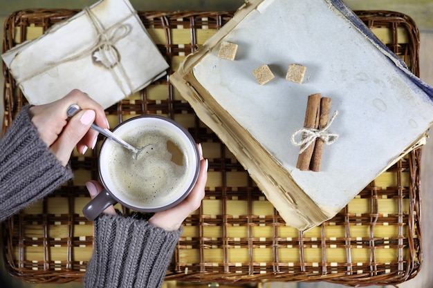 girl drinking coffee and looking at the card Valentine's Day