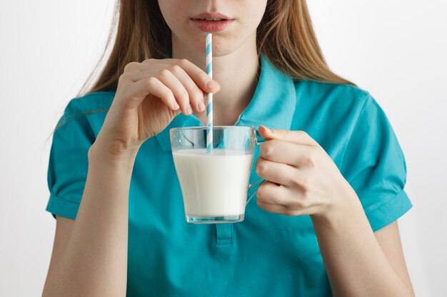 Girl drinking healthy lifestyle milk food with straw