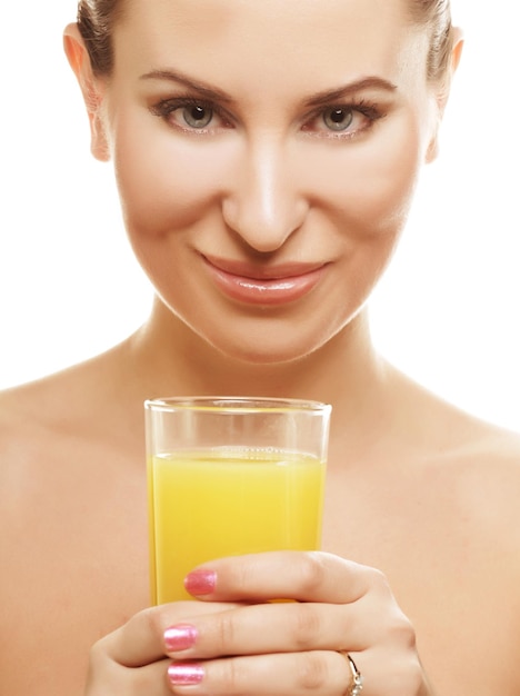 Girl drinking orange juice close up