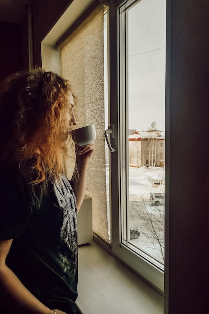 Girl drinks morning coffee