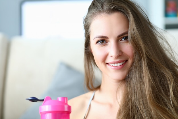 Girl drinks water from bottle prevent dehydration.