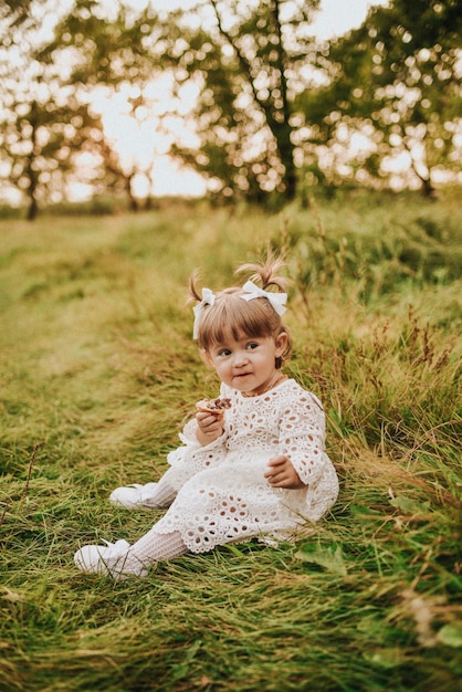 Girl eating croissant in the forest