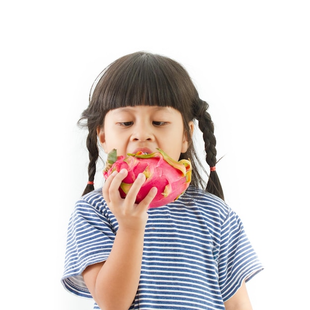 Photo girl eating pitaya against white background