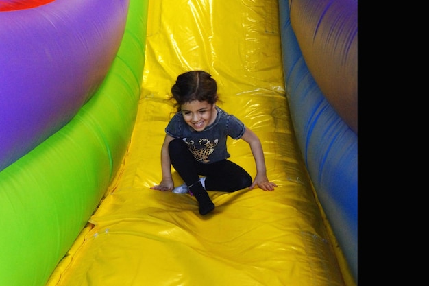 Girl enjoying on bouncy castle