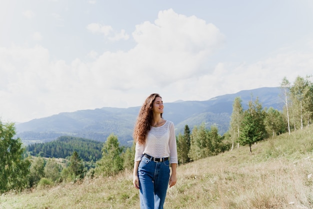 Girl enjoying the mountain hills view.  Tourism travelling in Ukraine.