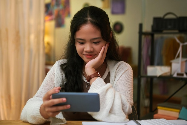 Photo girl enjoying watching funny videos