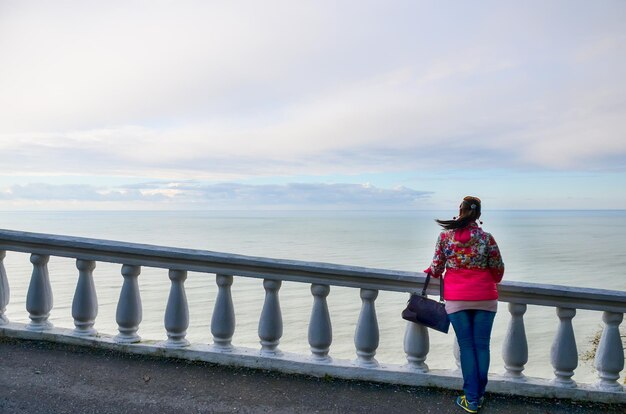 Girl enjoys views of the Black Sea in the botanical garden Georgia Batumi