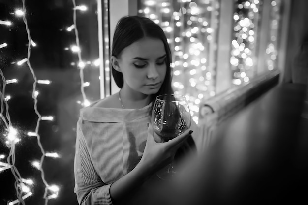 The girl in the evening rest in a cafe for a cocktail