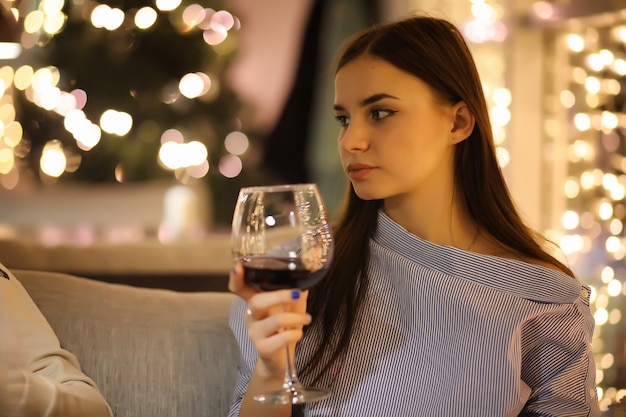 The girl in the evening rest in a cafe for a cocktail