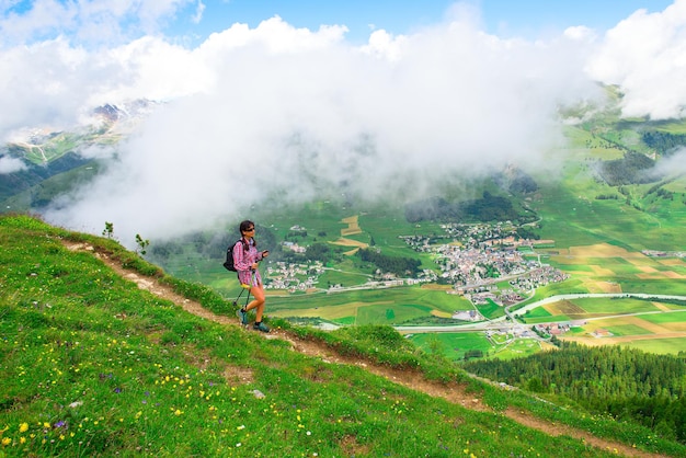 Girl during an excursion in Engadin valley above Zuoz village