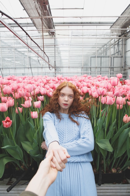 Girl falling on flowers