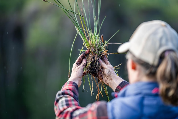 girl farmer holding plants in a field in australia