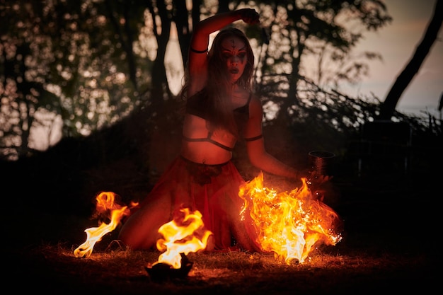 Girl fire dancing performance at outdoor art festival smooth movements of female artist