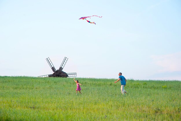 Girl flying a kite.