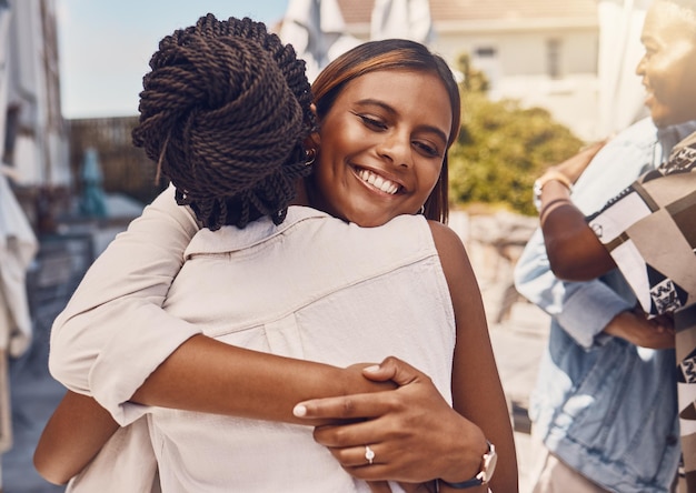 Girl friend friends and happy hug of women with a smile hugging with happiness and love Young female adult friendship of university students showing trust care and unity together smiling outdoors