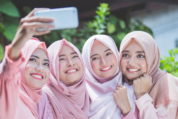 Girl friends taking selfie