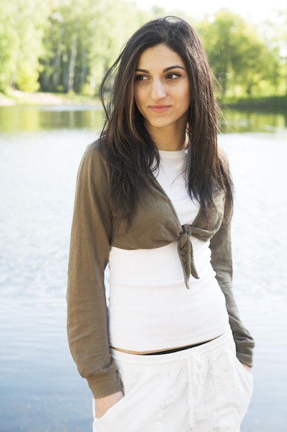 Girl girl beside a lake