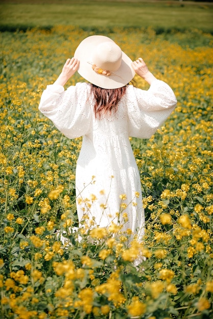 The girl goes on yellow field