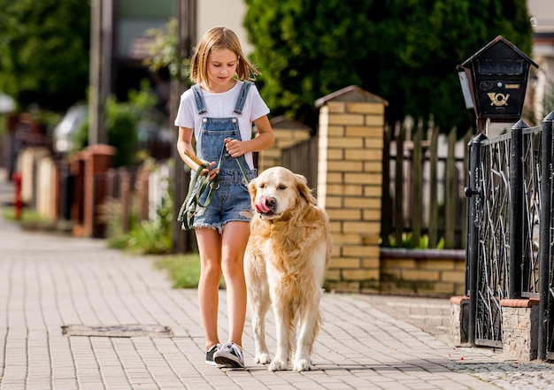 Girl and golden retriever dog