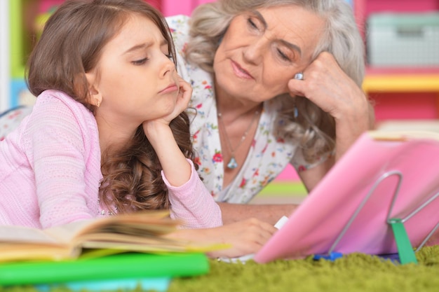 Girl and grandmother doing homework