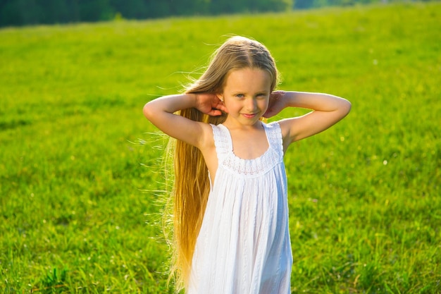 Girl on green grass.