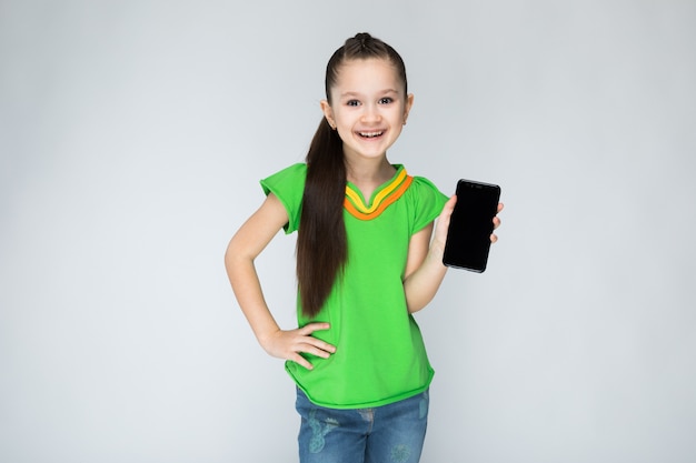 Girl in green t-shirt and blue jeans