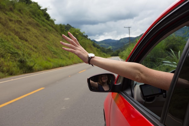 Girl hand at the car window