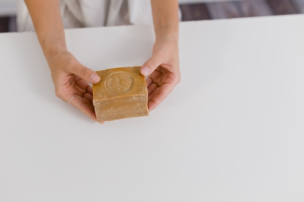 girl hands holding natural soap