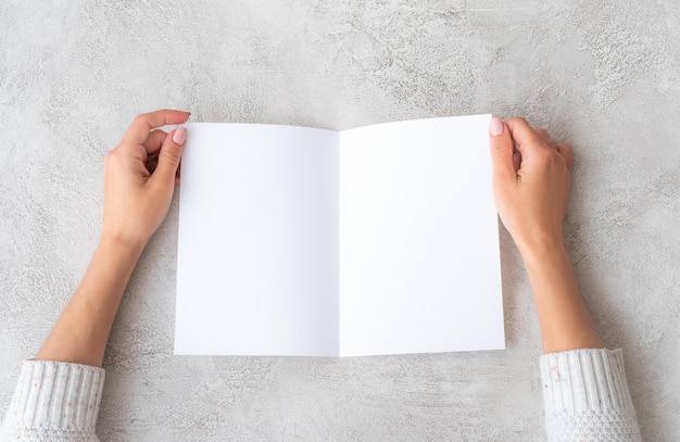 Girl hands with molded sheet of paper