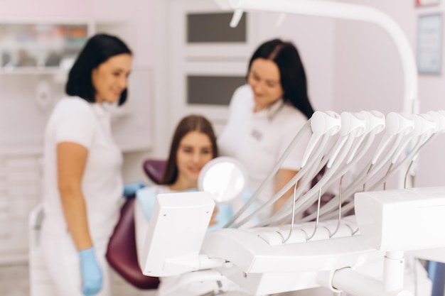 The girl has a visit to the dentist for a dental examination