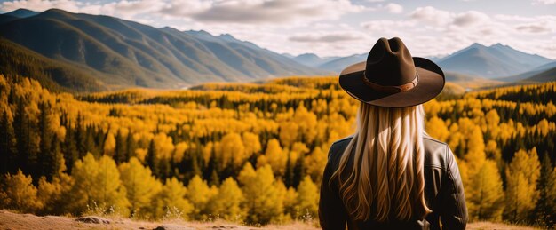 Girl in a hat and leather jacket on the background of mountains rear view panoramic banner Generative AI